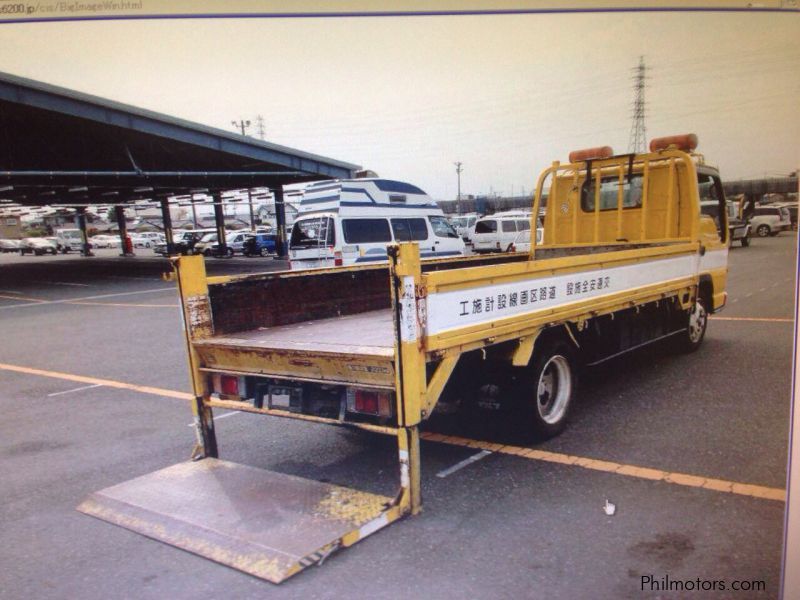Isuzu ELF 4HF1 NKR 14.7 Dropside with power gate in Philippines