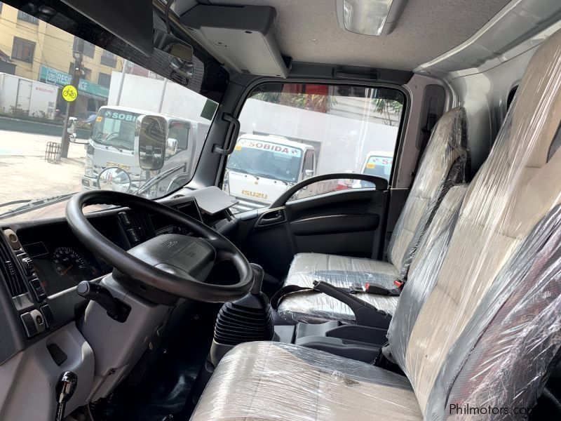 Isuzu elf surplus dump truck (semi high side) reconditioned in Philippines