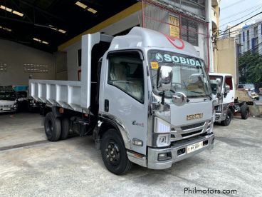 Pre-owned Isuzu elf surplus dump truck (semi high side) reconditioned for sale in