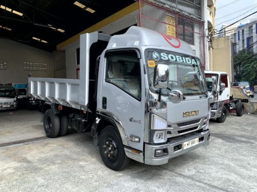 Isuzu elf surplus dump truck (semi high side) reconditioned in Philippines